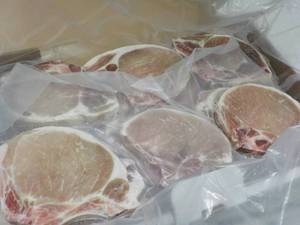 lot 521 image: 10 lb. Box Frozen Pork Chops...