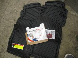lot 211 image: Weather Tech 4 Piece Car Mat Set...