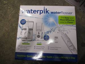 lot 214 image: Waterpik Water Flosser...