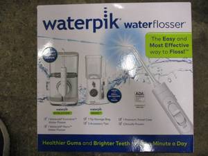 lot 230 image: WaterPik Water Flosser (small conta...