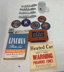 lot 38 image: Group Of Misc. Vintage Auto Emblems, Manuals And More