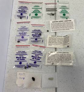 lot 90 image: Group Of Gems Including Black Star Of India, Amethyst, Garnet, Tamiz Emeralds And More