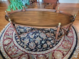 lot 17 image: Oval Rattan Inspired Cocktail Table