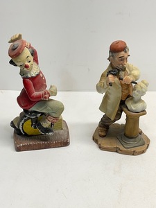 Hairdresser in Stone and Clown on Unicycle