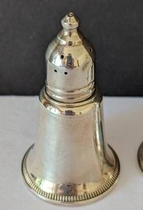 lot 97 image: Three Weighted Salt and Pepper Shakers