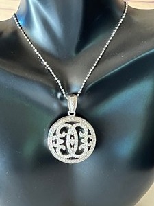 lot 148 image: Sparkling Sterling Pendant and Chain