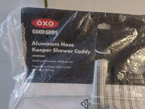 lot 38 image: OXO Good Grips 3 Tier Aluminum Shower Caddy, plus 2 towel racks