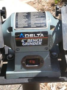 lot 25 image: Delta 6 Bench Grinder Mounted On a Cast Iron Stand