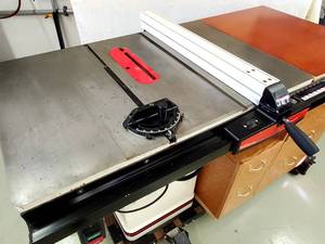 lot 9 image: JET Table Saw with a Built in Storage Cabinet on a Rolling Stand Model JWCS-10A