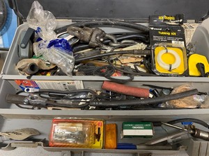 tool box full of misc and box of other supplies