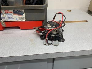small Inverter and looks to me like a winch control and plug wires