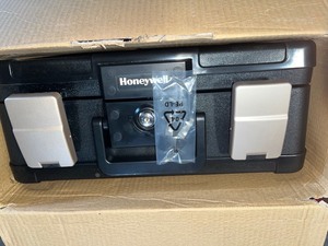 Honeywell 0.24 cu. ft. Molded Fire Resistant and Waterproof Portable Chest with Carry Handle, Key and Double Latch Lock