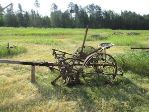 Vintage John Deere Tractor with farm Implement