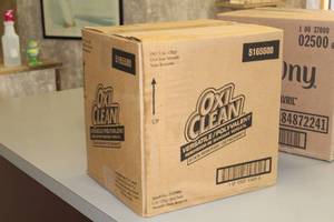 lot 93 image: Lot of (1 Case) OxiClean Versatile Stain Remover 1-oz Bottles 156-count