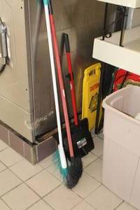 lot 98 image: Cleaning Supplies - (2) Brooms, Upright Dust Pan, Yellow Plastic CAUTION Sign