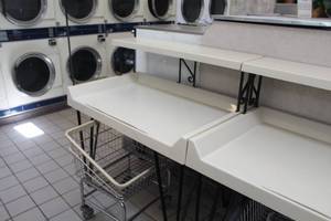 lot 102 image: Commercial Clothes Folding Table