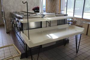 lot 113 image: Commercial Clothes Folding Table 2-tier