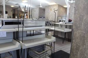 lot 119 image: Commercial Clothes Folding Table with (2) Hanger Racks 2-tier