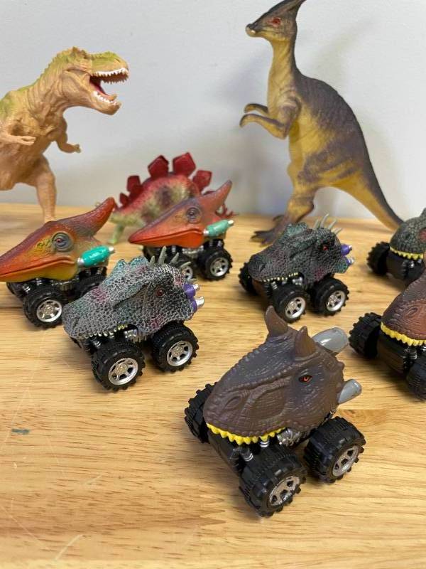 lot 58 image: Lot of Toy Dinosaurs and Monster Trucks