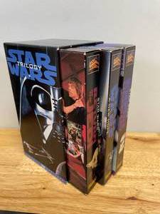lot 25 image: Lot of Collectible Star Wars VHS Tapes with Yoga Plush
