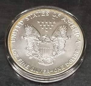 1990 AMERICAN SILVER EAGLE NICELY TONED IN AIRTITE