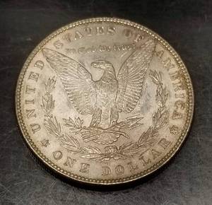 1886 MORGAN SILVER DOLLAR AU