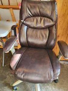 lot 10 image: A Brown Leather Desk Chair On Casters