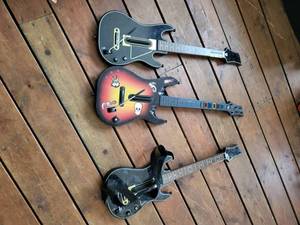 lot 115 image: Three Guitars