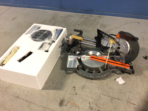 lot 106 image: Ridgid 15 Amp Corded 12 in. Dual Bevel Sliding Miter Saw with 70 Deg. Miter Capacity and LED Cut Line Indicator open box see pictures