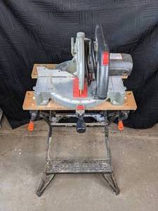 lot 5 image: Ace 10 Compound Miter Saw on a Black and Decker Workmate 200