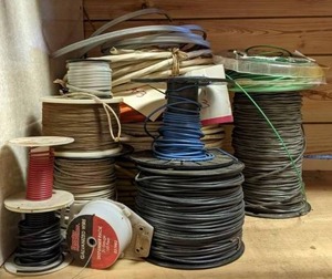 lot 64 image: Multiple Spools of Galvanized Wire, Other Wire and Cable, as well as Weedeater Line