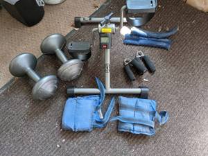 lot 340 image: Home Workout Equipment (Golds Gym Under Desk Bike Machine, Dumbbells, WristAnkle Weights, Grip Strengtheners)