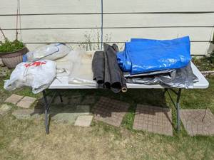 lot 253 image: Assortment of Tarps and Plastic Covers