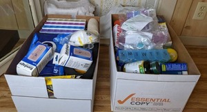lot 390 image: (2) Boxes of Miscellaneous Medical Supplies (Pill Boxes, Bandages, Vitamins, Adult Disposable Washcloths, Masks, Mini Nebulizer, and more)