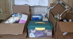 lot 382 image: (3) Boxes of Health and First Aid Items (Glass Scale, Bandages, Hydrogen Peroxide, Curlers, Toothpaste, and more)