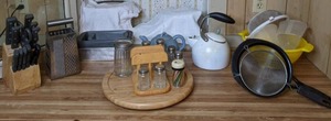 lot 366 image: Assortment of Miscellaneous KitchenBaking Items (Faberware Knife Set, Vintage Grater, Loaf Tins, Teapots, Lazy Susan, and more)