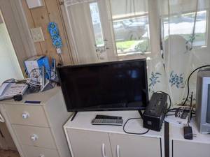 lot 226 image: Assortment of Electronics 24-Inch Vizio TV, Phone Systems, Radio and More