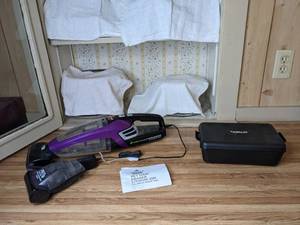 lot 232 image: Bissell Pet Hair Lithium Ion Cordless Hand Vacuum and Conair Trimmer
