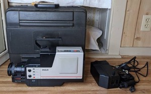 lot 328 image: Vintage RCA VHS Camcorder with Charger and Hard Sided Case