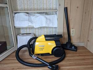 lot 215 image: Eureka Mighty Mite Bagged Canister Vacuum Cleaner, Yellow