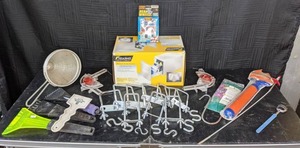 lot 945 image: Assorted Items Windshield Scrapers, U-Clamps, Hand Pump, Die Cast Metal Real Wheels Toy Cars, Back Scratcher and More