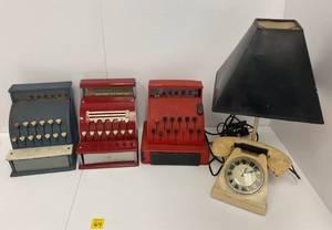 lot 64 image: Group Of Vintage Pressed Steel Toy Cash Registers And Cast Iron Phone Lamp With Clock