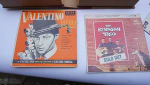 lot 43 image: Three-45 RPM records in albumbook