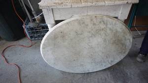 lot 103 image: Oval marble basetop measuring 33 x 25 12 as is