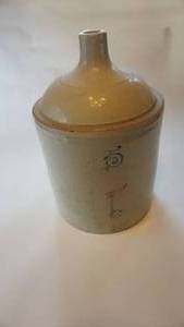 lot 126 image: 5 gallon red wing finger jug, small wing, hairline cracks