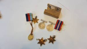 lot 152 image: World War II medals including the Italy star, the Africa star, the 1939 to 1945 star etc.