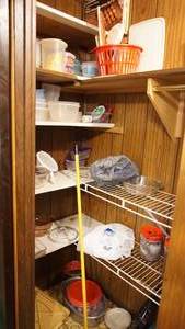 lot 169 image: Contents of closet including miscellaneous plastic containers baking dishes etc. SHELVING NOT INCLUDED