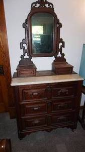 lot 260 image: Marble top mans dresser with drapery pole knob solid piece measuring 37 inches wide 19 inches do you 36 inches tall to the marble wake mirror 76 inches tall