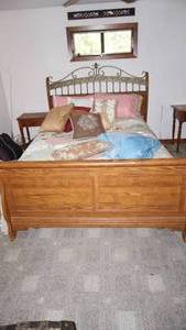 lot 261 image: Beautiful sleigh bed solid oak with steel headboard decoration includes bedding