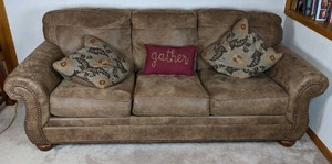 lot 33 image: Gorgeous 3-Seat Mocha Colored Sofa with Throw Pillows